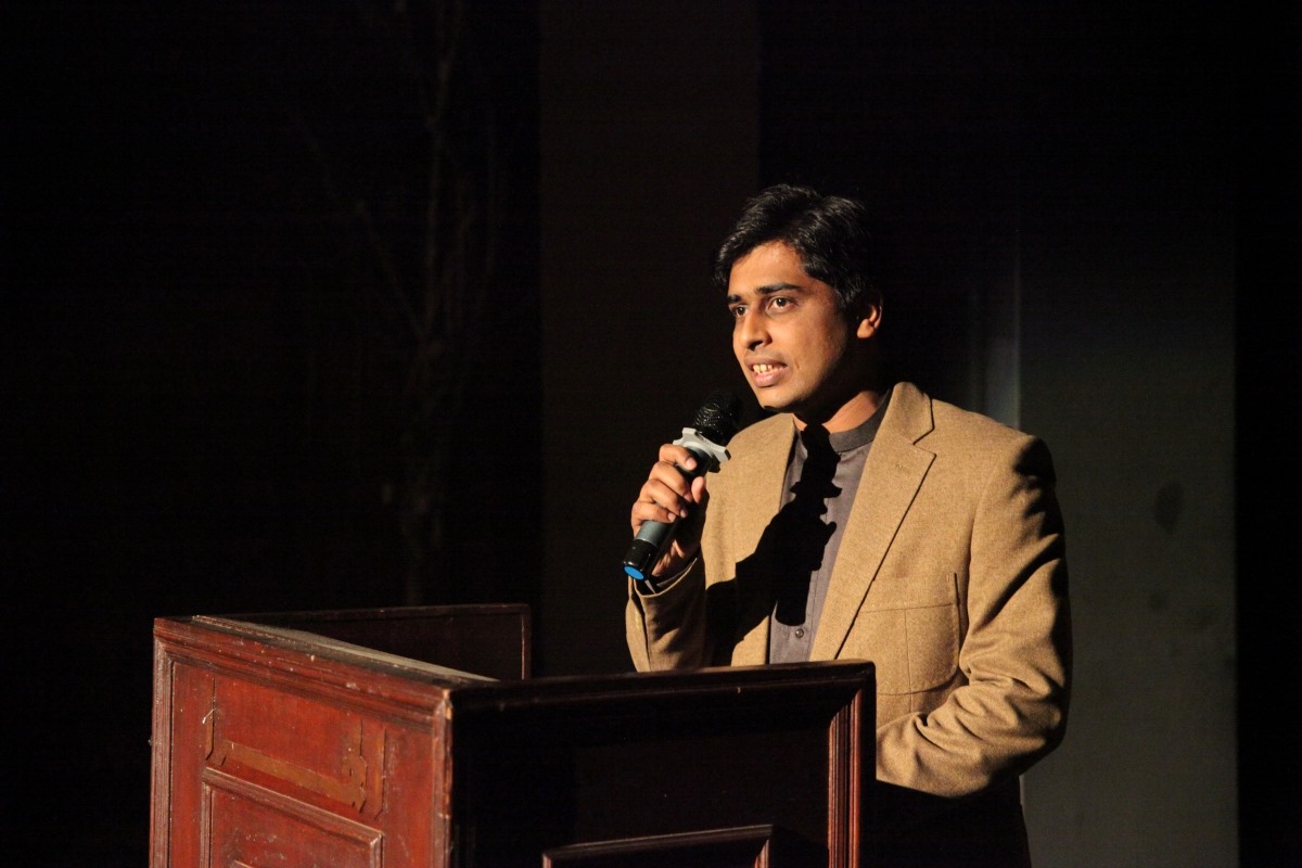 Umer Raza speaking at an IIS event